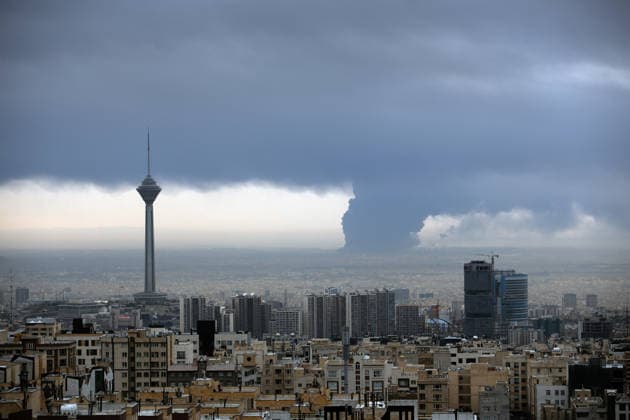 Fire breaks out in Shahran oil depot following US and Israeli attacks in Tehran TEHRAN, IRAN - MARCH 08: Smoke rises from Shahran oil depot after US and Israeli attacks, leaving numerous fuel tankers and vehicles in the area unusable in Tehran, Iran on March 08, 2026. Hassan Ghaedi Anadolu Tehran Iran. Editorial use only. Please get in touch for any other usage.  Copyright: x2026xAnadoluxHassanxGhaedix