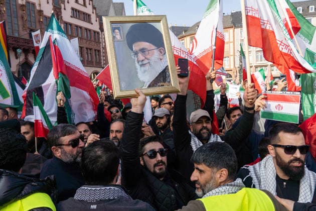 March 8, 2026, Frankfurt, Hesse, Germany: A man holds a portrait of Iran Supreme Leader Ayatollah Ali Khamenei, assassinated in an attack by Israel and the U.S., during a pro Ayatollah protest in Frankfurt, Germany. Frankfurt Germany - ZUMAb332 20260308_zip_b332_004 Copyright: xMatiasxBasualdox