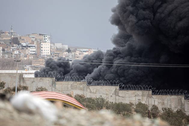 Plumes of smoke rise over the oil depot tanks hit by joint Israel-U.S. overnight in a station northwest of the capital in Tehran in Iran on Sunday, March 8, 2026.  IRN2026030806 str