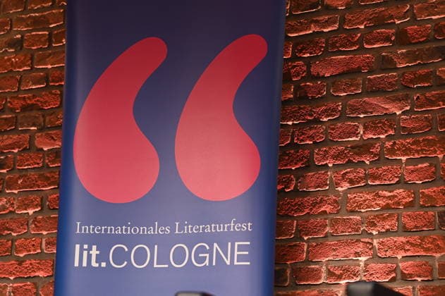 Stand with the logo and lettering of Lit Cologne, the international literature festival