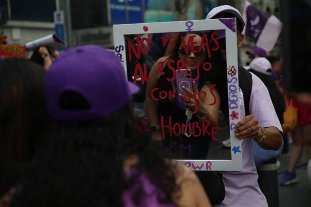 A woman takes a photo during a rally for the International Women s Day commemoration demand stop femicides in mexico and women s rights. Thousands of women around the world join the global International Women s Day strike. on March 8, 2026 in Mexico City, Mexico. Mexico City Mexico - ZUMAe321 20260308_zia_e321_070 Copyright: xBrendaxCarrerax