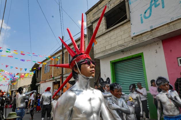 Traditional Xinacates Festival in San Nicolas de Los Ranchos An Inhabitant of San Nicolas de los Ranchos whit his body panted walking on the streets during the traditional Xinacates festival, also known as the Festival of the Painted, where they perform dances as an offering for the start of the crops and to obtain a good harvest in the municipality of San Nicolas de los Ranchos located on the slopes of the Popocatepetl volcano. on March 8, 2026 in San Nicolas de Los Ranchos, Mexico. (Photo by Ian Robles Eyepix Group) Copyright: xIanxRobles xEyepixxGroupx EL_08032026_177761JPEG