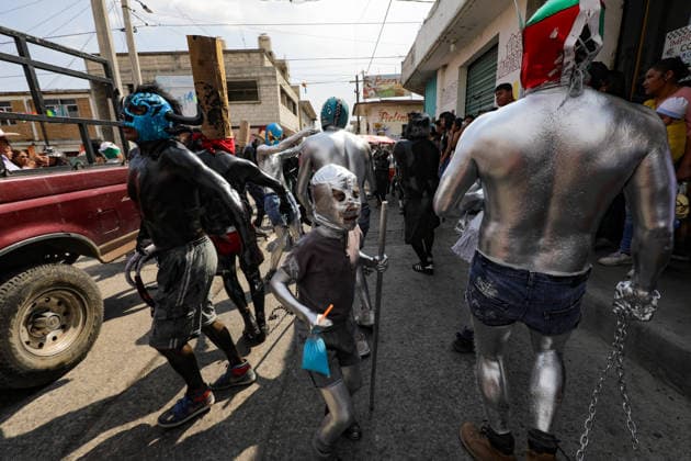 Traditional Xinacates Festival in San Nicolas de Los Ranchos Inhabitants of San Nicolas de los Ranchos whit their bodies panted walking on the streets during the traditional Xinacates festival, also known as the Festival of the Painted, where they perform dances as an offering for the start of the crops and to obtain a good harvest in the municipality of San Nicolas de los Ranchos located on the slopes of the Popocatepetl volcano. on March 8, 2026 in San Nicolas de Los Ranchos, Mexico. (Photo by Ian Robles Eyepix Group) Copyright: xIanxRobles xEyepixxGroupx EL_08032026_177765JPEG