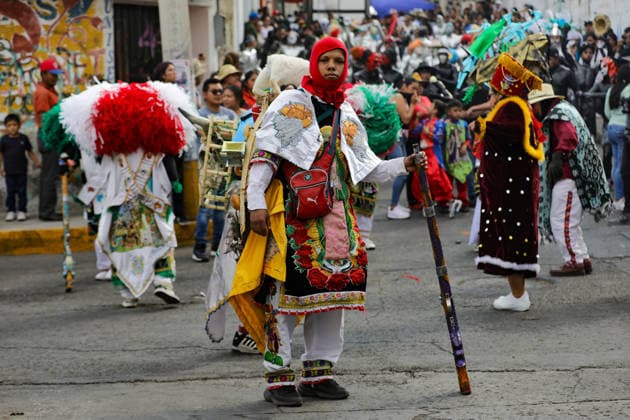 Traditional Xinacates Festival in San Nicolas de Los Ranchos An Inhabitant of San Nicolas de los Ranchos dancing during the traditional Xinacates festival, also known as the Festival of the Painted, where they perform dances as an offering for the start of the crops and to obtain a good harvest in the municipality of San Nicolas de los Ranchos located on the slopes of the Popocatepetl volcano. on March 8, 2026 in San Nicolas de Los Ranchos, Mexico. (Photo by Ian Robles Eyepix Group) Copyright: xIanxRobles xEyepixxGroupx EL_08032026_177779JPEG