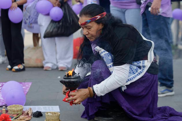 March 8, 2026, ChimalhuacaN, State Of Mexico, Mexico: A woman performs a cleansing ritual with incense beneath the statue of the Chimalli Warrior, where mothers and relatives of missing women and victims of femicide marched from the municipal seat of Chimalhuacan in the State of Mexico to demand justice and punishment for the perpetrators, on the occasion of International Women s Day in Mexico. According to the United Nations, International Women s Day is commemorated in many countries around the world. When women from all continents, often separated by national borders and ethnic, linguistic, cultural, economic and political differences, come together on this day, they can contemplate a tradition of no less than ninety years of struggle - ZUMAs197 20260308_aaa_s197_502 Copyright: xGerardoxVieyrax
