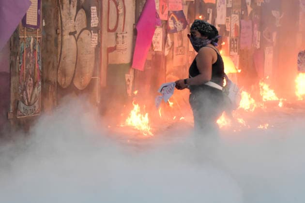 Protest For International Women s Day A woman burns placards in a rally for International Women s Day at main square Zocalo. on March 8, 2026 in Mexico City, Mexico. (Photo by Luis Barron Eyepix Group) Copyright: xLuisxBarronx xEyepixxGroupx LB_08032026_177794