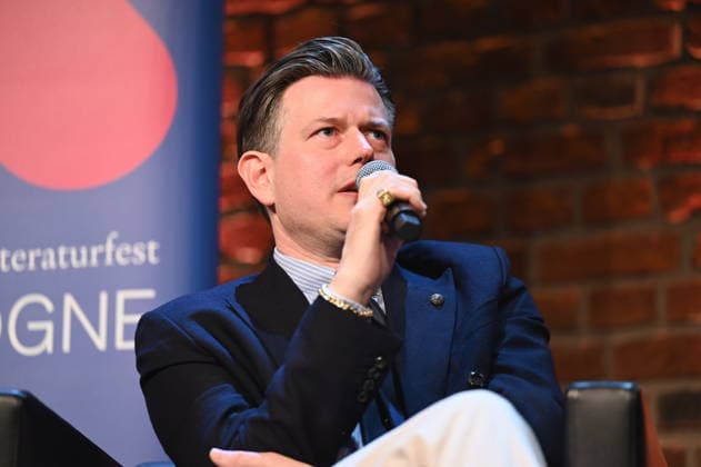Author Lenz Koppelstätter reads and speaks at Lit Cologne, the international literature festival