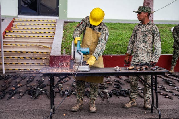 Mexican Army destroys seized weapons in Sinaloa SINALOA, MEXICO - MARCH 09: The Mexican Army destroy 610 long guns and 92 handguns, as well as 5,013 magazines and 316,036 rounds of ammunition during an official ceremony at the 9th Military Zone in Sinaloa, Mexico, on March 09, 2026. These weapons were seized from organized crime during recent federal operations in Sinaloa. Among the destroyed weapons were Colt 1911 pistols with gold embellishments that may have belonged to drug traffickers. Weapons seizures have increased in recent months due to the greater military presence in Sinaloa amid the ongoing conflict between internal factions of the Sinaloa Cartel. Jesus Verdugo Anadolu Sinaloa Mexico. Editorial use only. Please get in touch fo  Copyright: x2026xAnadoluxJesusxVerdugox