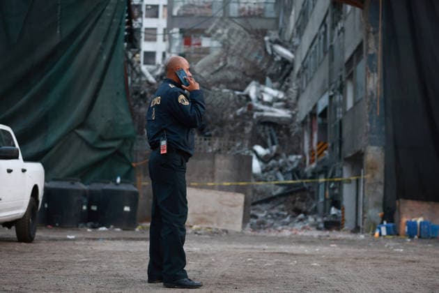 At least one dead, two still trapped after building collapses in Mexico City MEXICO CITY, MEXICO - MARCH 09: A firefighter uses his cellphone at the site of a partially collapsed building that left at least one person dead and two still trapped under the rubble, in Mexico City, Mexico on March 09, 2026. Rescue workers continue searching for people trapped in the building, which was undergoing demolition when the collapse occurred, while army and navy personnel secure the area. Daniel Cardenas Anadolu Mexico City Mexico. Editorial use only. Please get in touch for any other usage.  Copyright: x2026xAnadoluxDanielxCardenasx