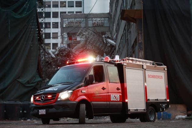 At least one dead, two still trapped after building collapses in Mexico City MEXICO CITY, MEXICO - MARCH 09: A fire truck leaves the area of a partially collapsed building that left at least one person dead and two still trapped under the rubble, in Mexico City, Mexico on March 09, 2026. Rescue workers continue searching for people trapped in the building, which was undergoing demolition when the collapse occurred, while army and navy personnel secure the area. Daniel Cardenas Anadolu Mexico City Mexico. Editorial use only. Please get in touch for any other usage.  Copyright: x2026xAnadoluxDanielxCardenasx