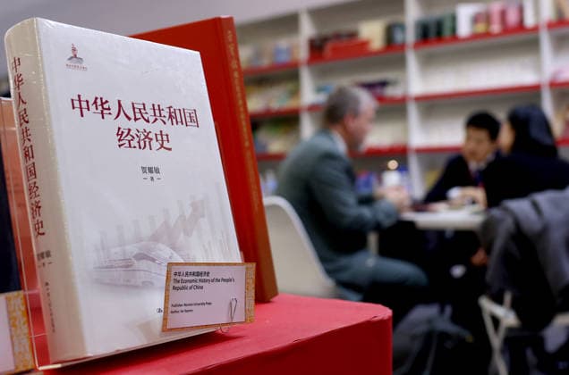 (260311) -- LONDON, March 11, 2026 -- People talk at the China Pavilion of the 2026 London Book Fair in London, Britain, March 10, 2026. At Olympia London, where the 2026 London Book Fair opened Tuesday, the China pavilion stands out not merely for its expansive footprint, but for the comprehensive publishing ecosystem it showcases. The Chinese publishing delegation has arrived with an impressive portfolio of over 4,000 titles and a packed schedule of more than 40 events. Spanning the three-day fair, the agenda ranges from high-profile new book launches and author talks to rights exchanges and industry forums. TO GO WITH Feature: Two-way street -- China s delegation highlights cultural synergy, tech fusion at London Book Fair ) BRI
