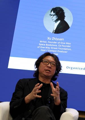 (260311) -- LONDON, March 11, 2026 -- Chinese writer Xu Zhiyuan talks at the 2026 London Book Fair in London, Britain, March 10, 2026. At Olympia London, where the 2026 London Book Fair opened Tuesday, the China pavilion stands out not merely for its expansive footprint, but for the comprehensive publishing ecosystem it showcases. The Chinese publishing delegation has arrived with an impressive portfolio of over 4,000 titles and a packed schedule of more than 40 events. Spanning the three-day fair, the agenda ranges from high-profile new book launches and author talks to rights exchanges and industry forums. TO GO WITH Feature: Two-way street -- China s delegation highlights cultural synergy, tech fusion at London Book Fair ) BRITA