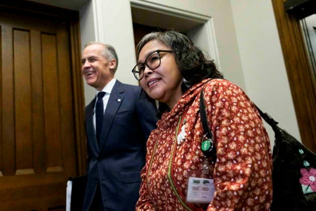 March 11, 2026, Ottawa, On, CAN: MP for Nunavut Lori Idlout, who crossed the floor from the NDP to the Liberals, arrives with Prime Minister Mark Carney for a meeting of the Liberal caucus on Parliament Hill in Ottawa, on Wednesday, March 11, 2026. Ottawa CAN  - ZUMAc35_ 20260311_zaf_c35_018 Copyright: xJustinxTangx