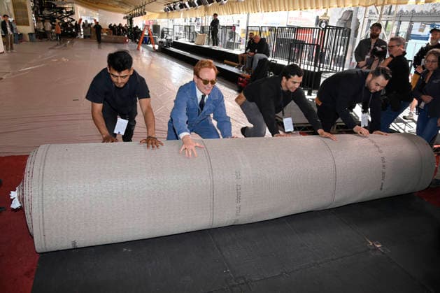 Conan O Brien joins in with the crew during the 98th annual Academy Awards red carpet roll out at Ovation Hollywood in Los Angeles on Wednesday, March 11, 2026. O Brien will host the Oscars for the second consecutive year, airing live on March 15 on ABC.  LAP2026031124 JIMxRUYMEN