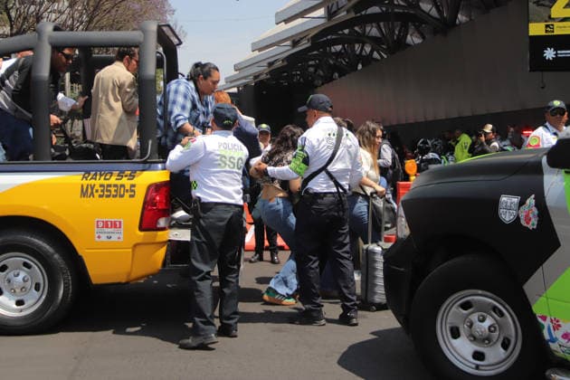 Taxi Drivers Protest Against App Taxi Service At Mexico™s International Airport Police officers are using their patrol cars as a support service to help passengers get to Mexico City International Airport due Taxi drivers blocking road to protest against transportation services by app. on March 11, 2026 in Mexico City, Mexico. Mexico City CDMX Mexico Copyright: xCarlosxSantiagox