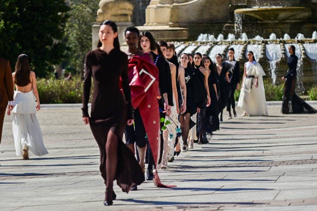 March 12, 2026, Madrid, Madrid, SPAIN: Models walk the runway on the urban catwalk set up in Plaza de EspaoÂ±a during the opening event of OMODA Madrid es Moda, marking the start of Madrid Fashion Week. The show brings together 25 Spanish independent fashion designers in one of the capital s most iconic locations. Madrid SPAIN  - ZUMAz108 20260312_znp_z108_025 Copyright: xRichardxZubelzux