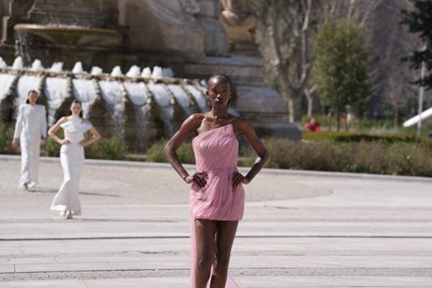 March 12, 2026, Madrid, Madrid, SPAIN: Models walk the runway on the urban catwalk set up in Plaza de Espana during the opening event of OMODA Madrid es Moda, marking the start of Madrid Fashion Week. The show brings together 25 Spanish independent fashion designers in one of the capital s most iconic locations Cordon Press 