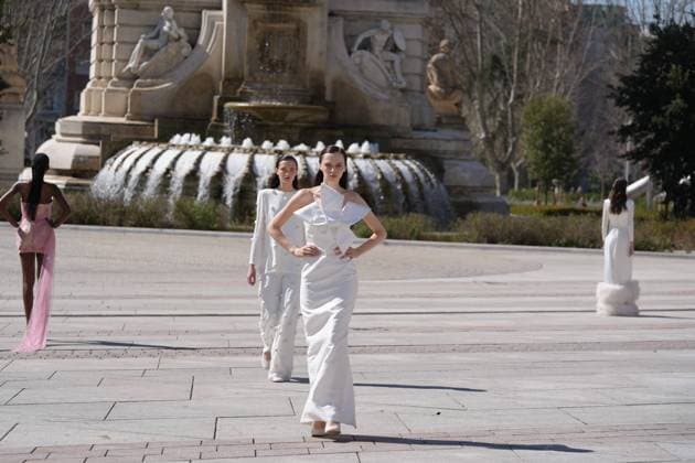 March 12, 2026, Madrid, Madrid, SPAIN: Models walk the runway on the urban catwalk set up in Plaza de Espana during the opening event of OMODA Madrid es Moda, marking the start of Madrid Fashion Week. The show brings together 25 Spanish independent fashion designers in one of the capital s most iconic locations Cordon Press 