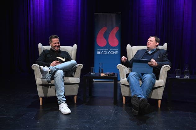 Author Linus Geschke and journalist Mike Altwicker, l r, reads and speaks at Lit Cologne, the international literature festival