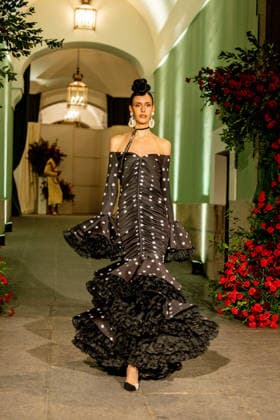 Juana Martín presents her new collection of flamenco fashion and prêt a porter A model parades presenting the new collection of flamenco fashion and prêt a porter of the designer Juana Martín, at the Real Academia de Bellas Artes de San Fernando, on March 12, 2026, in Madrid Spain Juana Martín, designer from Cordoba of gypsy origin and the first Spanish woman to parade in the Haute Couture in Paris, presents today her flamenco collection Herencia The fashion show, framed in the Madrid fashion week OMODA Madrid es Moda , is her only event in Spain in 2026 and pays tribute to the flower as a timeless symbol of flamenco 12 MARCH 2026 FASHION DESIGNER COLLECTION MODEL SHOWS SHOWS catwalk Madrid Madrid Spain  Copyright: xRicardoxRubiox 7361764
