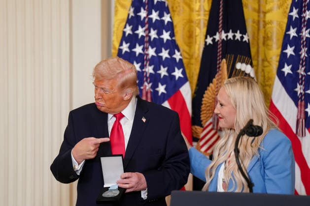 March 12, 2026, Washington, District Of Columbia, USA: Kaillie Humphries, United States Olympic bronze medalist bobsled athlete, presents the Order of Ikkos to US President Donald J Trump during a Women s History Month event in the East Room of the White House in Washington, DC, USA, on Thursday, March 12, 2026. Every year, March is designated Women s History Month by presidential proclamation Washington USA - ZUMAs152 20260312_faa_s152_044 Copyright: xAlxDragox-xPoolxviaxCNPx