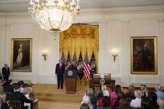 March 12, 2026, Washington, District Of Columbia, USA: First lady Melania Trump, right, makes remarks as she and United States President Donald J Trump, left, hope a Women™s History month reception in the East Room of the White House in Washington, DC, USA, on Thursday, March 12, 2026. Every year, March is designated Women s History Month by presidential proclamation Washington USA - ZUMAs152 20260312_faa_s152_055 Copyright: xAlxDragox-xPoolxviaxCNPx