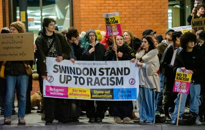 March 12, 2026, Swindon, Wiltshire, UK: Swindon, UK. A protest takes place outside the venue before Nigel Farage, the leader of the political party Reform UK, speaks at a Reform UK Swindon Local Election Rally with local MP Danny Kruger and hosted by Reform Chairman Dr. David Bull at the Meca Swindon venue, in the run up to the local elections in May. Swindon UK  - ZUMAl94_ 20260312_zaf_l94_028 Copyright: xSimonxChapmanx