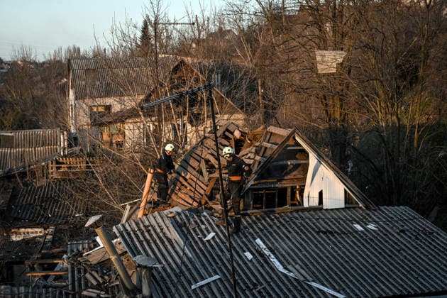 Russian troops strike Zaporizhzhia with guided aerial bombs Rescue workers stand on the roof of a house damaged by a Russian strike with guided aerial bombs in Zaporizhzhia, Ukraine, on March 11, 2026. Russian forces attack residential areas of the city, injuring 12 people, including four children Zaporizhzhia Ukraine  Copyright: xDmytroxSmolienkox originalFilename: ukrinform-russiant260312_np0IJ.jpg