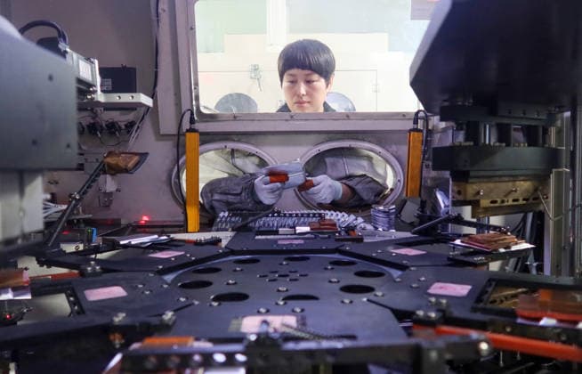 Lithium-ion Batteries Manufacturing in Sanmenxia SANMENXIA, CHINA - MARCH 12, 2026 - A worker in the production workshop of Henan Pude New Energy Technology Co., Ltd. is engaged in the production of lithium-ion batteries in Sanmenxia City, Henan Province, China on March 12, 2026. Sanmenxia Henan China  Copyright: xCFOTOx i1773416480038