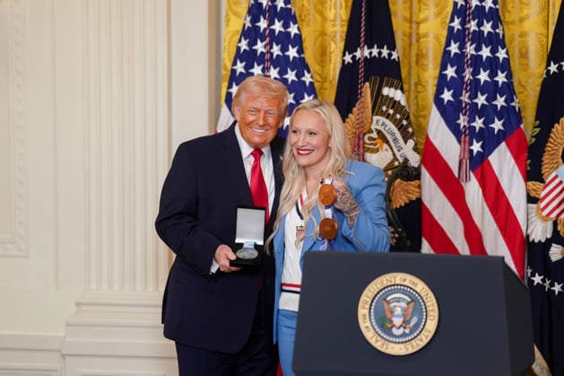 Trump Hosts Women s History Month Event Kaillie Humphries, United States Olympic bronze medalist bobsled athlete, presents the Order of Ikkos to US President Donald J Trump during a Women s History Month event in the East Room of the White House in Washington, DC, USA, on Thursday, March 12, 2026. Every year, March is designated Women s History Month by presidential proclamation. Credit: CNP AdMedia Washington District of Columbia United States of America EDITORIAL USE ONLY  Copyright: xx FTP_AD_04020_1-6137913 CNPx xAdMediax admphotostwo974273