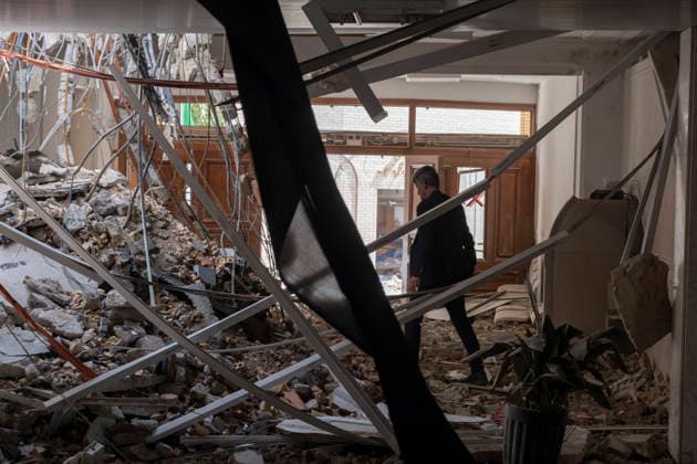 Isfahan Governor s Office Following U.S. And Israeli Attacks An Iranian man walks among the ruins of the Provincial Governor s Office, located a hundred meters from the historical sites, after it is destroyed during the U.S.-Israeli military campaign in Isfahan, Iran, on March 11, 2026. Tehran Iran  Copyright: xMortezaxNikoubazlx originalFilename: nikoubazl-isfahang260311_npIlK.jpg