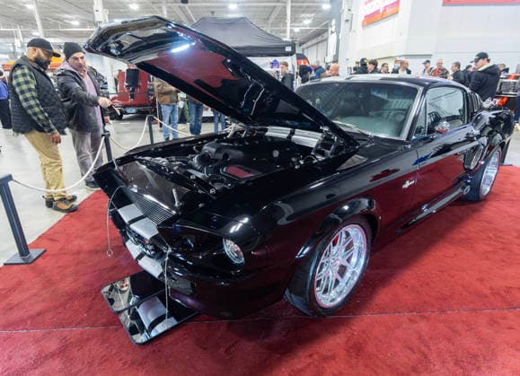 (260314) -- MISSISSAUGA, March 14, 2026 -- People view a custom vehicle at the 2026 Motorama Custom Car & Motorsports Expo in Mississauga, the Greater Toronto Area, Canada, March 13, 2026. The three-day event kicked off here on Friday, showcasing more than 400 custom vehicles. (Photo by Xinhua) CANADA-MISSISSAUGA-MOTORAMA-EXPO ZouxZheng 