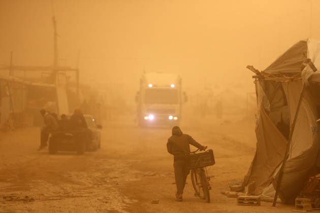 Sand Storm In Gaza, Palestine Palestinians walk amidst dust during a sandstorm in Gaza City, Palestine, on March 14, 2026. Gaza Palestine  Copyright: xMajdixFathix originalFilename: fathi-notitle260314_npGEy.jpg
