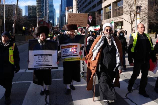 Al-Quds Day Rally in Toronto TORONTO, CANADA - MARCH 14 : People take part in a Al-Quds Day rally in Toronto, Ontario, Canada on March 14, 2026. Demonstrators carrying Palestinian and Iranian flags gathered near US Consulate General to protest Israel and the United States attacks on Iran and Lebanon, and marched in downtown Toronto. Mert Alper Dervis Anadolu Toronto Canada. Editorial use only. Please get in touch for any other usage.  Copyright: x2026xAnadoluxMertxAlperxDervisx