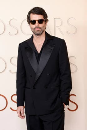 Adolpho Veloso arrives on the red carpet for the 98th annual Academy Awards in the Hollywood section of Los Angeles on Sunday, March 15, 2026. Conan O Brien will host the Oscars for the second consecutive year.  LAP20260315401 JOHNxANGELILLO