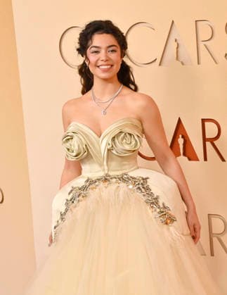 Auli i Cravalho arrives on the red carpet for the 98th annual Academy Awards in the Hollywood section of Los Angeles on Sunday, March 15, 2026. Conan O Brien will host the Oscars for the second consecutive year.  LAP20260315132 JIMxRUYMEN