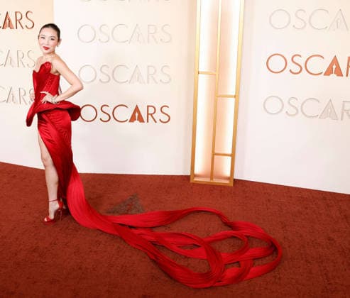 Li Jun Li arrives on the red carpet for the 98th annual Academy Awards in the Hollywood section of Los Angeles on Sunday, March 15, 2026. Conan O Brien will host the Oscars for the second consecutive year.  LAP20260315451 JOHNxANGELILLO