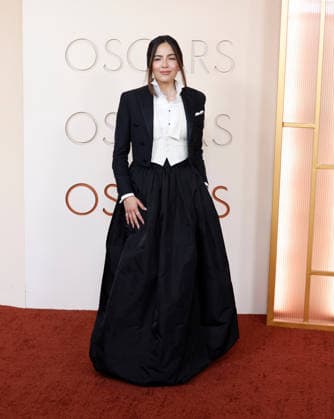 Erin Lim Rhodes arrives on the red carpet for the 98th annual Academy Awards in the Hollywood section of Los Angeles on Sunday, March 15, 2026. Conan O Brien will host the Oscars for the second consecutive year.  LAP20260315454 JOHNxANGELILLO