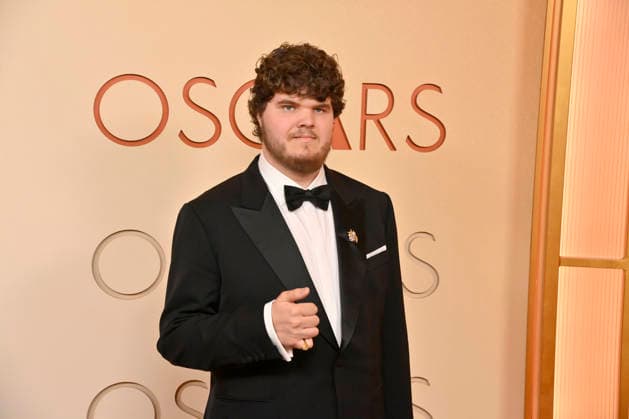 Aidan Delbis arrives on the red carpet for the 98th annual Academy Awards in the Hollywood section of Los Angeles on Sunday, March 15, 2026. Conan O Brien will host the Oscars for the second consecutive year.  LAP20260315118 JIMxRUYMEN
