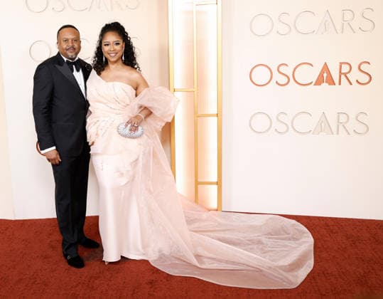 (L-R) Davon Jennings and Shunika Terry-Jennings arrive on the red carpet for the 98th annual Academy Awards in the Hollywood section of Los Angeles on Sunday, March 15, 2026. Conan O Brien will host the Oscars for the second consecutive year.  LAP20260315421 JOHNxANGELILLO
