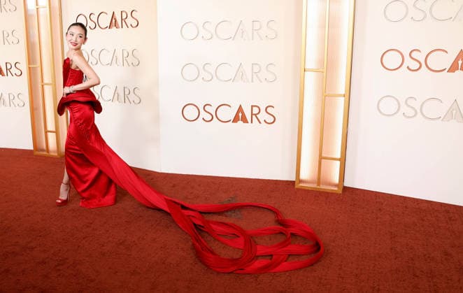 Li Jun Li arrives on the red carpet for the 98th annual Academy Awards in the Hollywood section of Los Angeles on Sunday, March 15, 2026. Conan O Brien will host the Oscars for the second consecutive year.  LAP20260315444 JOHNxANGELILLO