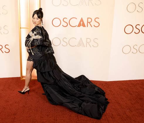 Rei Ami arrives on the red carpet for the 98th annual Academy Awards in the Hollywood section of Los Angeles on Sunday, March 15, 2026. Conan O Brien will host the Oscars for the second consecutive year.  LAP20260315505 JOHNxANGELILLO