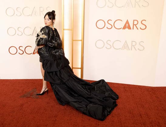 Rei Ami arrives on the red carpet for the 98th annual Academy Awards in the Hollywood section of Los Angeles on Sunday, March 15, 2026. Conan O Brien will host the Oscars for the second consecutive year.  LAP20260315506 JOHNxANGELILLO