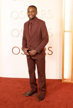 Miles Caton arrives on the red carpet for the 98th annual Academy Awards in the Hollywood section of Los Angeles on Sunday, March 15, 2026. Conan O Brien will host the Oscars for the second consecutive year.  LAP20260315516 JOHNxANGELILLO