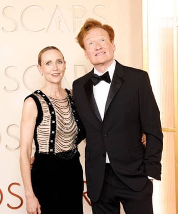 (L-R) Liza Powel O Brien and Conan O Brien arrive on the red carpet for the 98th annual Academy Awards in the Hollywood section of Los Angeles on Sunday, March 15, 2026. Conan O Brien will host the Oscars for the second consecutive year.  LAP20260315518 JOHNxANGELILLO
