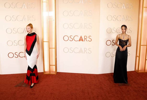 (L-R) Miyako Bellizzi and Zoe Saldana arrive on the red carpet for the 98th annual Academy Awards in the Hollywood section of Los Angeles on Sunday, March 15, 2026. Conan O Brien will host the Oscars for the second consecutive year.  LAP20260315575 JOHNxANGELILLO