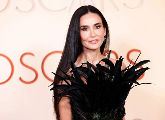Demi Moore arrives on the red carpet for the 98th annual Academy Awards in the Hollywood section of Los Angeles on Sunday, March 15, 2026. Conan O Brien will host the Oscars for the second consecutive year.  LAP20260315553 JOHNxANGELILLO