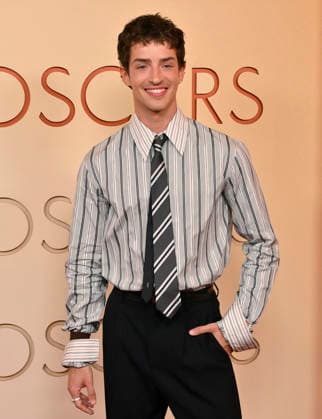 Manu Rios arrives on the red carpet for the 98th annual Academy Awards in the Hollywood section of Los Angeles on Sunday, March 15, 2026. Conan O Brien will host the Oscars for the second consecutive year.  LAP20260315182 JIMxRUYMEN