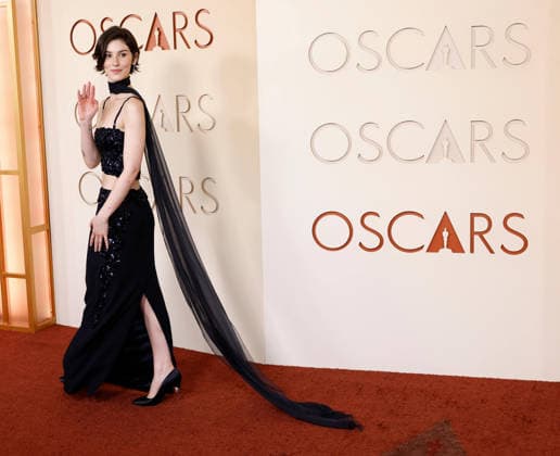 Gracie Abrams attends the 98th Oscars arrival on the red carpet for the 98th annual Academy Awards in the Hollywood section of Los Angeles on Sunday, March 15, 2026. Conan O Brien will host the Oscars for the second consecutive year.  LAP20260315627 JOHNxANGELILLO