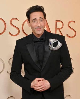 Adrien Brody arrives on the red carpet for the 98th annual Academy Awards in the Hollywood section of Los Angeles on Sunday, March 15, 2026. Conan O Brien will host the Oscars for the second consecutive year.  LAP20260315231 JIMxRUYMEN